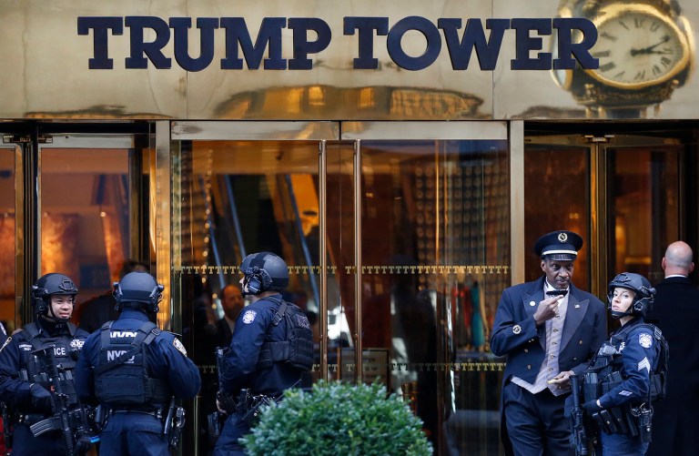 Members of the New York Police Department's counterterrorism unit guard Trump Tower. The federal government should be footing the bill for security at Trump Tower while President-elect Trump is in New York, a Republican congressman said. (AP Photo/Mark Lennihan)