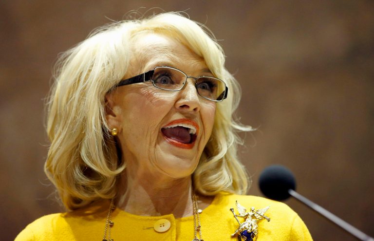 Arizona Gov. Jan Brewer announces her plan to end the current Child Protective Services agency by executive order during her State of the State address in the Arizona House of Representatives at the Arizona Capitol. (AP Photo/Ross D. Franklin)