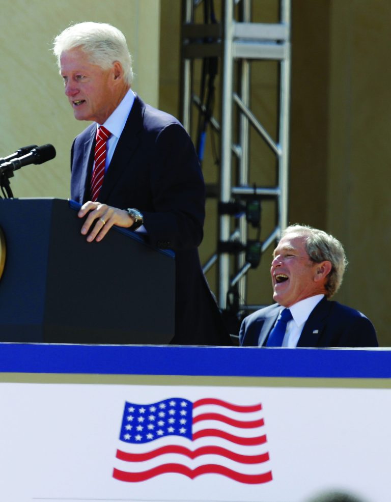 Tony Gutierrez/AP
Former President George W. Bush laughs as former President Bill Clinton speaks at the dedication of the George W. Bush Presidential Center, Thursday, April 25, 2013, in Dallas.