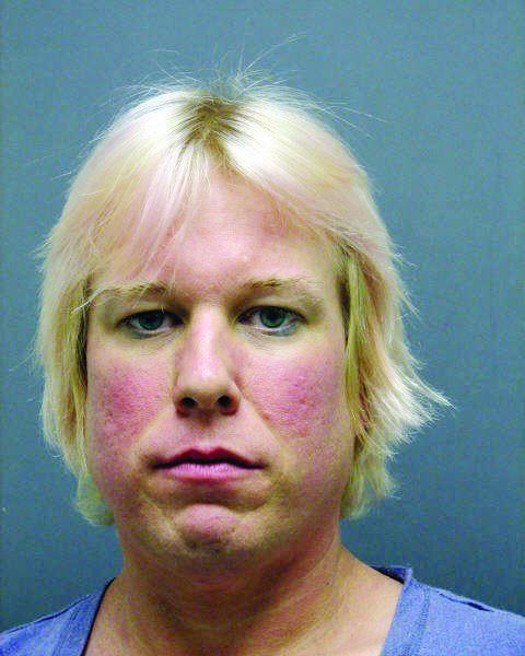 Police: Woman who tried to ram officer found with guns