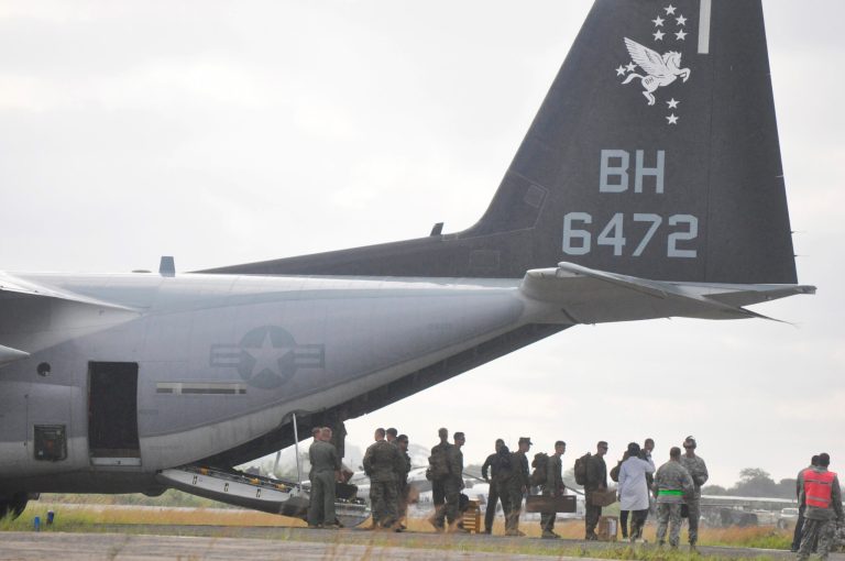 U.S Marines disembark upon their arrival at the Roberts International airport in Monrovia, Liberia, Thursday, Oct. 9, 2014. Six U.S. military planes arrived Thursday at the epicenter of the Ebola crisis, carrying more aid and American Marines into Liberia, the country hardest hit by the deadly disease that has devastated West Africa and stirred anxiety across a fearful world. (AP Photo/Abbas Dulleh)
