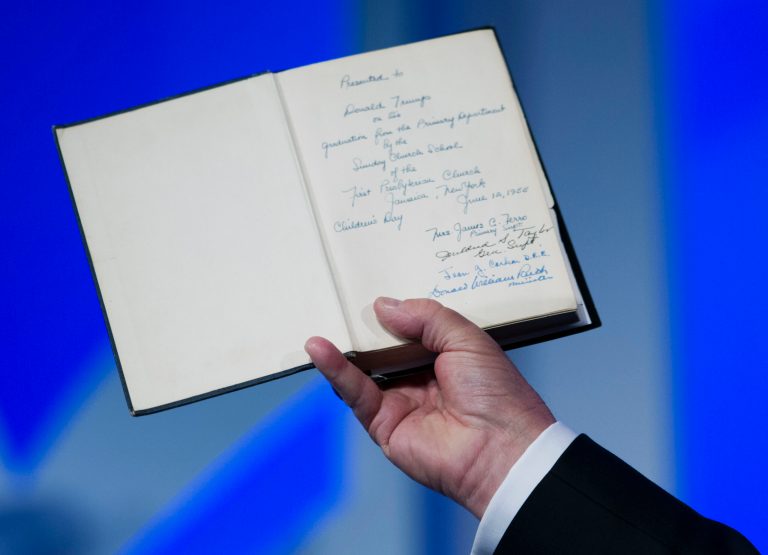 Republican presidential candidate, businessman Donald Trump, holds up his bible that was giveb to him by his mother as he speaks during the Values Voter Summit, held by the Family Research Council Action, Friday, Sept. 25, 2015, in Washington. ( AP Photo/Jose Luis Magana)