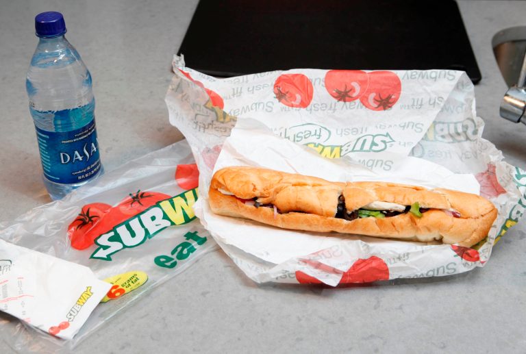 FILE - This Aug. 11, 2009, file photo, shows a chicken breast sandwich and water from Subway on a kitchen counter in New York. Subway says an ingredient dubbed the 