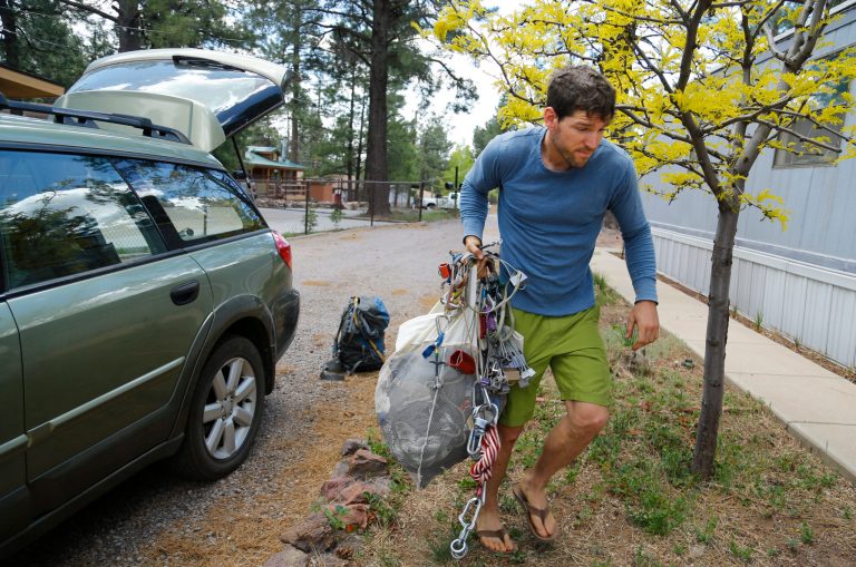 Mike Willyaung moves his belongings back in Kachina Village, Monday, May 26, 2014, near Flagstaff  Ariz.  Willyaung headed pre-evacuation orders due to the Slide Fire. Crews have mostly completed burnout operations on the key northern flank of the Slide Fire and are preparing to make similar protection efforts on the fire's western end. (AP Photo/The Arizona Republic, David Kadlubowski)  MARICOPA COUNTY OUT; MAGS OUT; NO SALES