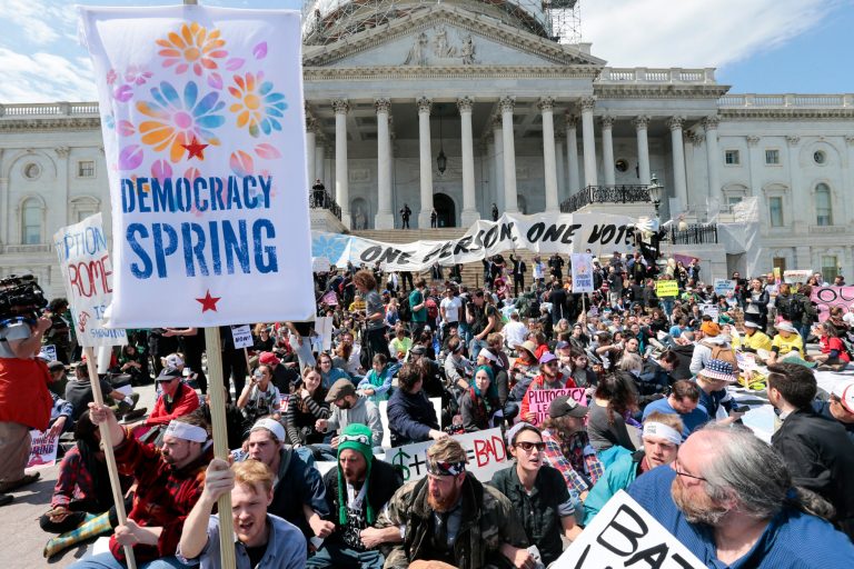 Voting rights reform demonstrators stage a sit-in at the Capitol in Washington, Monday, April 11, 2016, urging lawmakers to take money out of the political process. (AP Photo/J. Scott Applewhite)