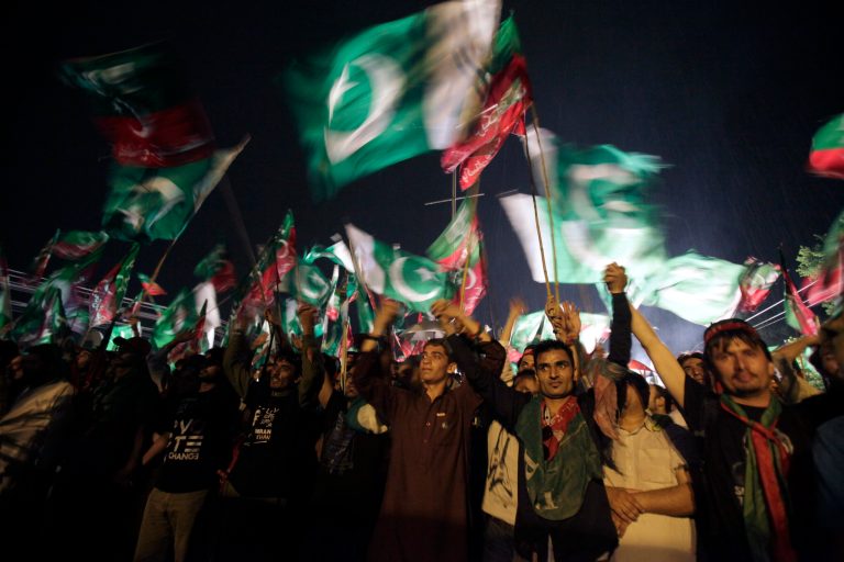 Supporters of Pakistan's cricketer-turned-politician Imran Khan take part in an anti government rally in Islamabad, Pakistan, Saturday, Aug. 16, 2014. Tens of thousands of anti-government protesters gathered in Pakistan's capital Islamabad late Friday in the pouring rain following the arrival of convoys led by Khan and a fiery anti-Taliban cleric. (AP Photo/Anjum Naveed)
