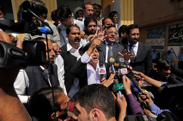 Supporters of Pakistan's former President and military ruler Pervez Musharraf chant slogans against the court decision at the High Court in Islamabad, Pakistan, Thursday, April 18, 2013. Musharraf and his security team pushed past policemen and sped away from a court in the country's capital on Thursday after his bail was revoked in a case in which he is accused of treason. (AP Photo/B.K. Bangash)