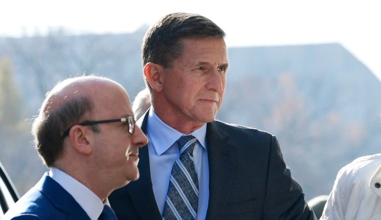 Former Trump national security adviser Michael Flynn (pictured center) arrives at federal court in Washington, Friday, Dec. 1, 2017. Court documents show Flynn, an early and vocal supporter on the campaign trail of President Trump whose business dealings and foreign interactions made him a central focus of Robert Mueller's investigation, will admit to lying about his conversations with Russia's ambassador to the U.S. during the transition period before Trump's inauguration. (AP Photo/Susan Walsh)