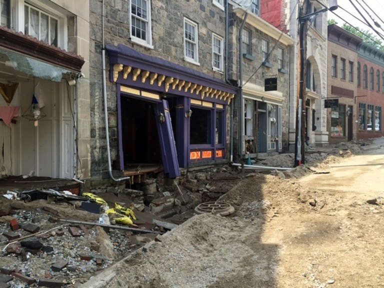 Damage in historic Ellicott City, Md., could be attributable to climate change, an EPA report says. (AP Photo/Juliet Linderman)