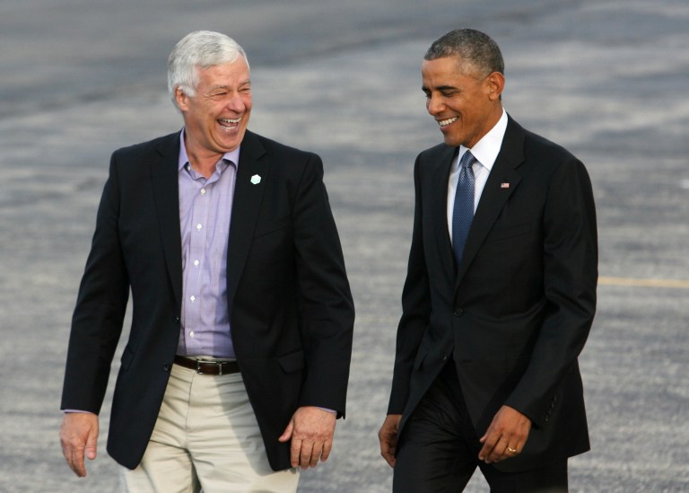 President Obama walks across the tarmac with Rep. Mike Michaud, D-Maine. (AP Photo/Joel Page)