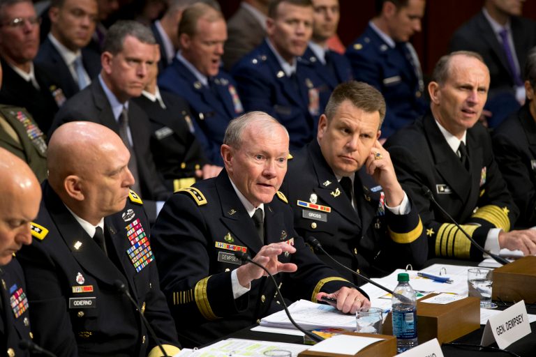 In this June 4 file photo, Joint Chiefs Chairman Gen. Martin Dempsey, center, testifies on Capitol Hill in Washington, before the Senate Armed Services Committee hearing investigating the growing epidemic of sexual assaults within the military. The number of reported sexual assaults across the military shot up by more than 50 percent this year. Defense officials suggest that victims are becoming more willing to come forward. (AP Photo/J. Scott Applewhite)