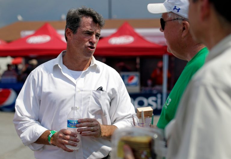 Maryland Attorney General Doug Gansler, candidate for Maryland governor, chats with festival-goers in Crisfield, Md., Wednesday, July 17, 2013, during the 37th annual J. Millard Tawes Crab and Clam Bake. A handful of Maryland politicians got an extra early start on campaigning for 2014 at the outdoor all-you-can-eat affair, a 