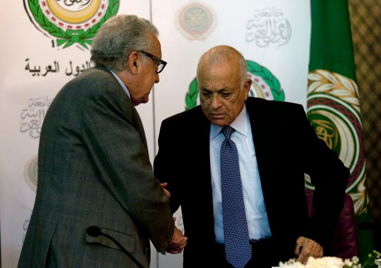   U.N.-Arab League envoy to Syria Lakhdar Brahimi, left, shakes hands with Arab League Secretary-General Nabil Elaraby following a joint press conference at the Arab League headquarters in Cairo, Egypt, Sunday, Dec. 30, 2012. The international envoy to Syria warned Sunday that as many as 100,000 could die in the next year if a solution is not reached quickly to end the countryâs civil war. (AP Photo/Nasser Nasser)  