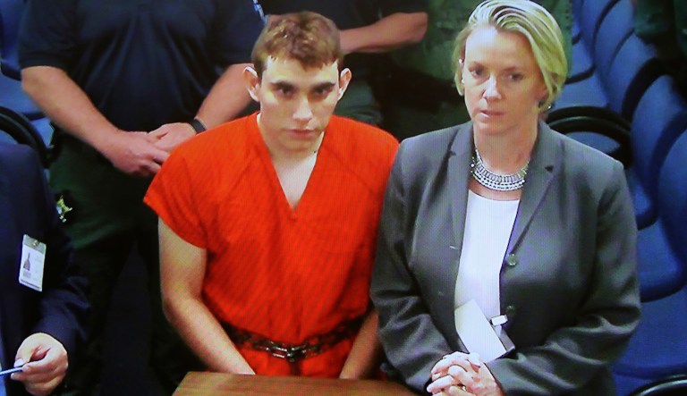 Florida school shooting suspect Nikolas Cruz, left, making an appearance before a judge in Broward County Court. Cruz is accused of opening fire Wednesday at the school killing more than a dozen people and injuring several. (Susan Stocker/South Florida Sun-Sentinel via AP, Pool)