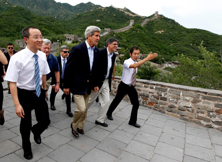 U.S. Secretary of State John Kerry, third right, U.S. Treasury Secretary Jack Lew, second right, and U.S. Ambassador to China Max Baucus, second left,  tour the Badaling section of the Great Wall of China with Chen Fei, left, deputy director of the Badaling Great Wall Special District, and Guo Jiaqiang, right, deputy director of the Badaling Foreign Affairs Office, in Beijing, July 8, 2014. (AP Photo/Jim Bourg, Pool)