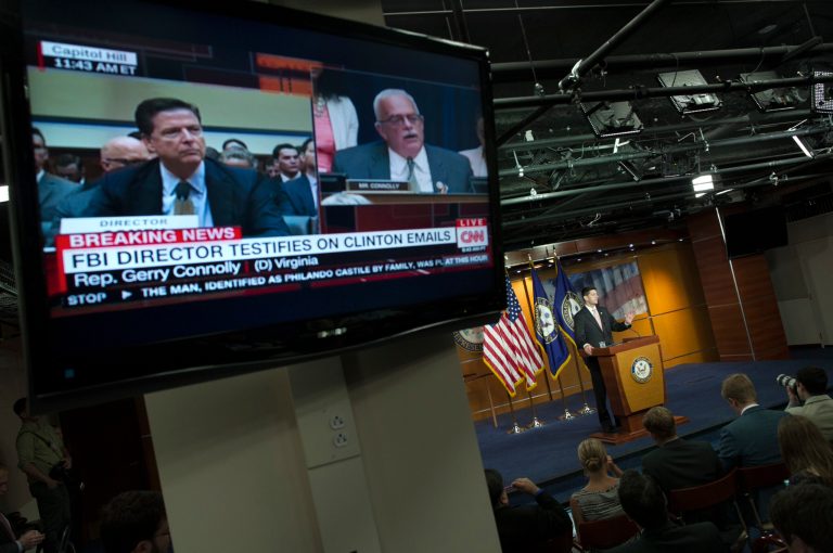 A television monitor shows House Oversight and Government Reform Committee member Rep. Gerry Connolly, D-Va., right, questioning FBI Director James Comey, as House Speaker Paul Ryan of Wis. speaks during a news conference on Capitol Hill in Washington, Thursday, July 7, 2016. (AP Photo/Cliff Owen)