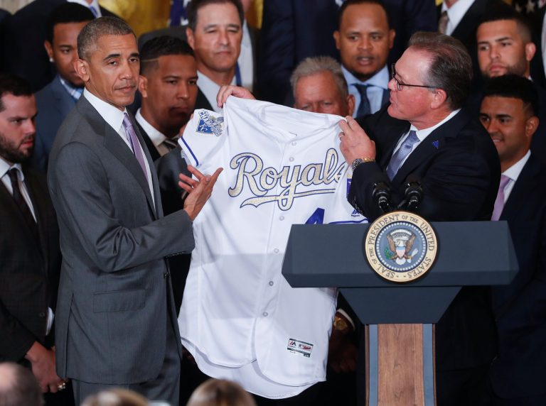 President Barack Obama holds up a Kansas City Royals baseball jersey presented to him by team manager Ned Yost, right, during a ceremony in the East Room of the White House in Washington, Thursday, July 21, 2016, where the president honored the 2015 World Series Champion baseball team. (AP Photo/Pablo Martinez Monsivais)