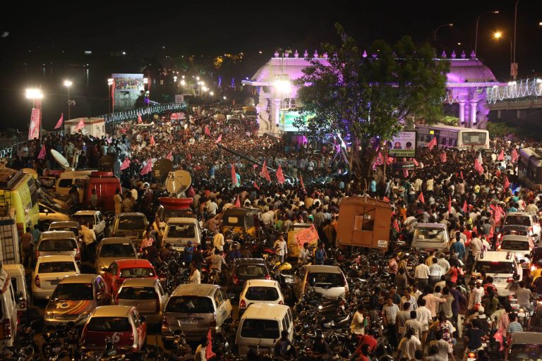In this Sunday, June 1, 2014, photo, close to midnight, people celebrate on the street the formation of India's 29th state, Telangana, in Hyderabad, India. Celebrations greeted the creation Monday of India's newest state of Telangana, marking the formal division of the southern state of Andhra Pradesh. (AP Photo/Mahesh Kumar A.)