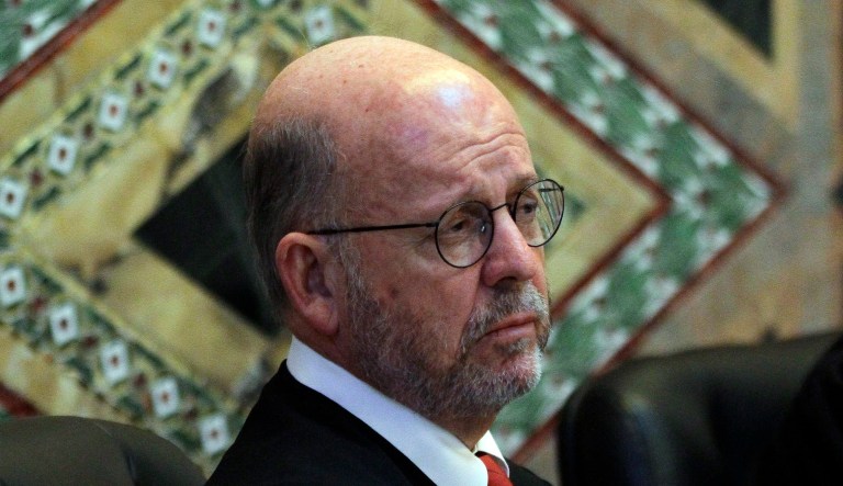 Senior Circuit Judge Michael Daly Hawkins (pictured above) hears arguments during a hearing in the Ninth Circuit Court of Appeals. On Wednesday, he questioned Deputy Assistant Attorney General Hashim Mooppan about whether President Trump's travel ban could yield results similar to what happened to Tom Hanks' character in the film 
