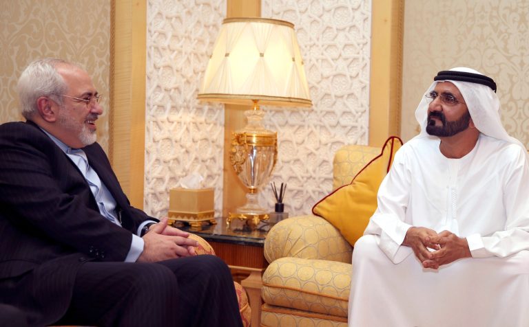 In this image released by the Emirates News Agency, WAM, Iranian Foreign Minister Mohamad Javad Zarif, left, meets with Sheikh Mohammed bin Rashid Al Maktoum, UAE Prime Minister and ruler of Dubai to discuss bilateral relations and regional developments, in Dubai, United Arab Emirates, Tuesday, April 15, 2014. (AP Photo/ WAM )