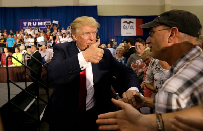 Republican presidential candidate Donald Trump greets supporters during a rally, Tuesday, Aug. 25, 2015, in Dubuque, Iowa. (AP Photo/Charlie Neibergall)