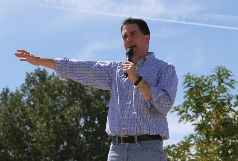 Scott WalkerÂ hesitated to give Trump's three-pronged approach a 