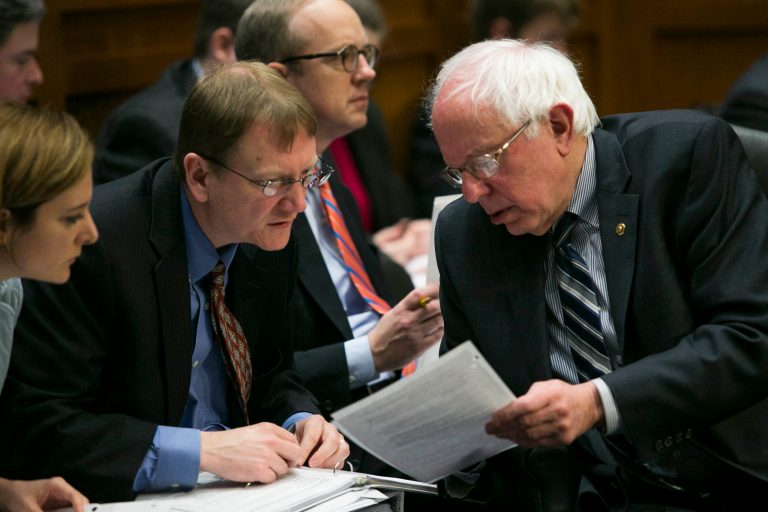 Ranking member of the Senate Budget Committee, Bernie Sanders, I-Vt., confers with congressional staff members at a Senate Budget Committee meeting on Capitol Hill, in Washington, Thursday, March 19. 2015. (Graeme Jennings/Washington Examiner)