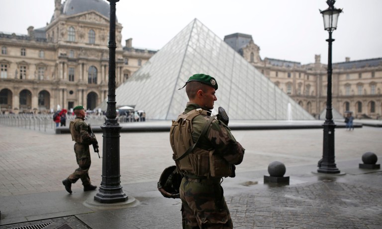 Soldiers patrol in the courtyard of the Louvre museum in Paris, France. (AP Photo/Kamil Zihnioglu)