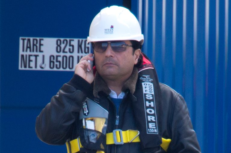 Captain Francesco Schettino talks on the phone as he waits to board the wreck of the Costa Concordia cruise ship, just off the coast of the Giglio island, Thursday, Feb. 27, 2014. The captain of the Costa Concordia has been permitted to go aboard the shipwreck for the first time since it capsized two years ago as part of a new court-ordered search. Consumer groups and lawyers for Capt. Francesco Schettino asked the court in Grosseto to authorize the searches to determine if any factors beyond human error contributed to the disaster. After searching the bridge and elevators last month, experts will examine the emergency generators Thursday. (AP Photo/Andrew Medichini)