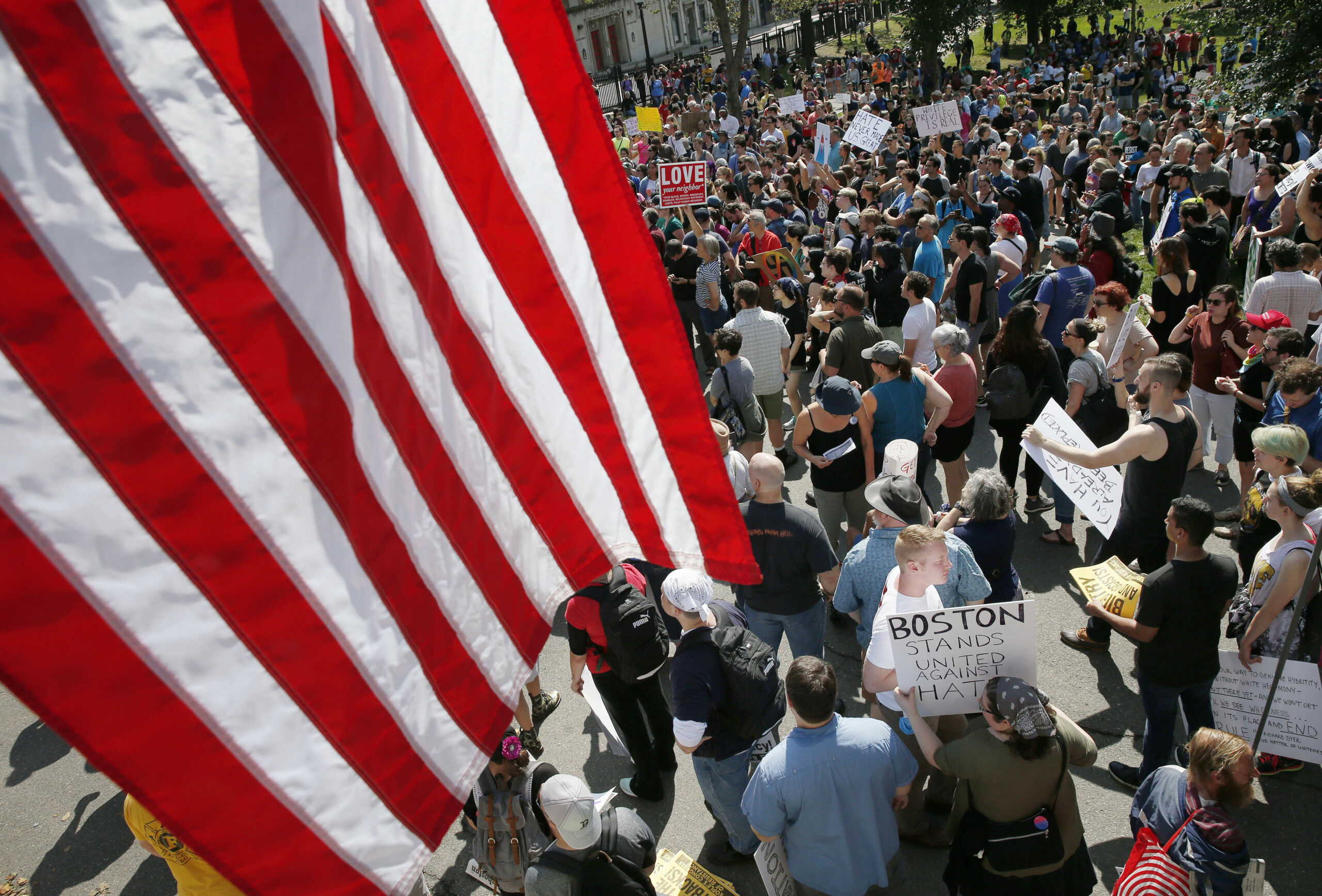 Eight signs from Saturday’s demonstrations in Boston