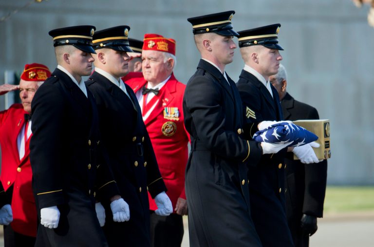 Army honor guards carry the urn containing the remains of Medal of Honor Soldier, Army Pvt. Miguel A. Vera, from the Korean War, Thursday, Nov. 20, 2014, during burial services at Arlington National Cemetery in Arlington, Va. (AP Photo/Manuel Balce Ceneta)