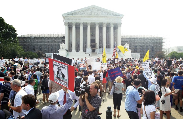Obamacare supporters and protesters gather in front of the U.S. Supreme Court to find out the ruling on the Affordable Health Act June 28, 2012 in front of the U.S. Supreme Court in Washington, D.C. (Photo by Alex Wong/Getty Images)