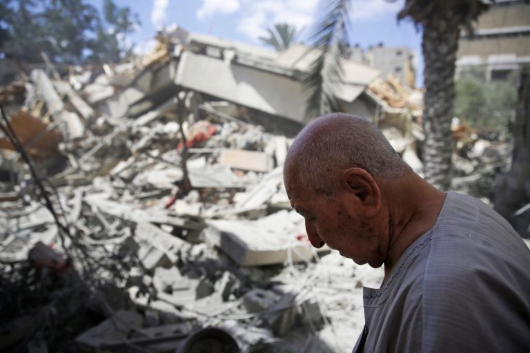 A Palestinian man pauses as he inspects the rubble of building, destroyed by an Israeli strike, in Gaza City, northern Gaza Strip, Friday, July 18, 2014. Israeli troops pushed deeper into Gaza on Friday to destroy rocket launching sites and tunnels, firing volleys of tank shells and clashing with Palestinian fighters in a high-stakes ground offensive meant to weaken the enclave's Hamas rulers. If Israel and the Palestinian militants of Hamas can agree on one point, it seems, it's that things have to change. (AP Photo/Lefteris Pitarakis)