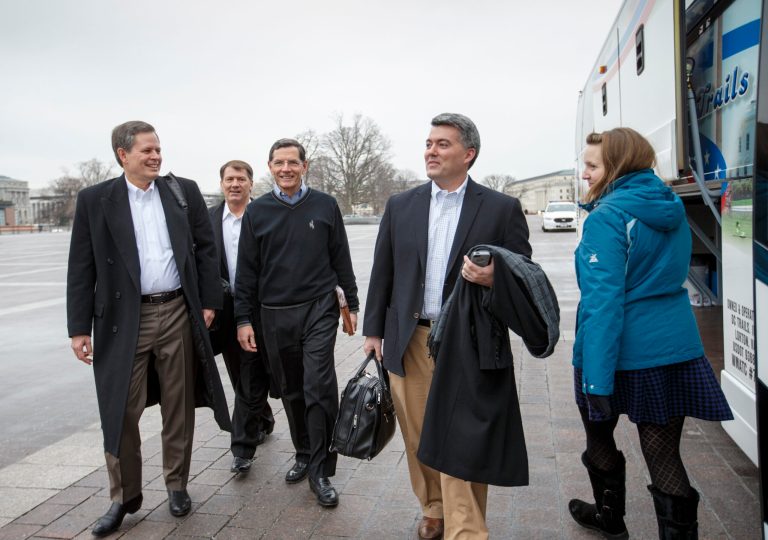 From left, Sen. Steve Daines, R-Mont., Sen. Mike Rounds, R-S.D., Sen. John Barrasso, R-Wyo., and Sen. Cory Gardner, R-Colo., prepare to board a tour bus to join Senate and House Republicans at a two-day policy retreat in Hershey, Pa., Wednesday, Jan. 14, 2015, on Capitol Hill in Washington. (AP Photo/J. Scott Applewhite)