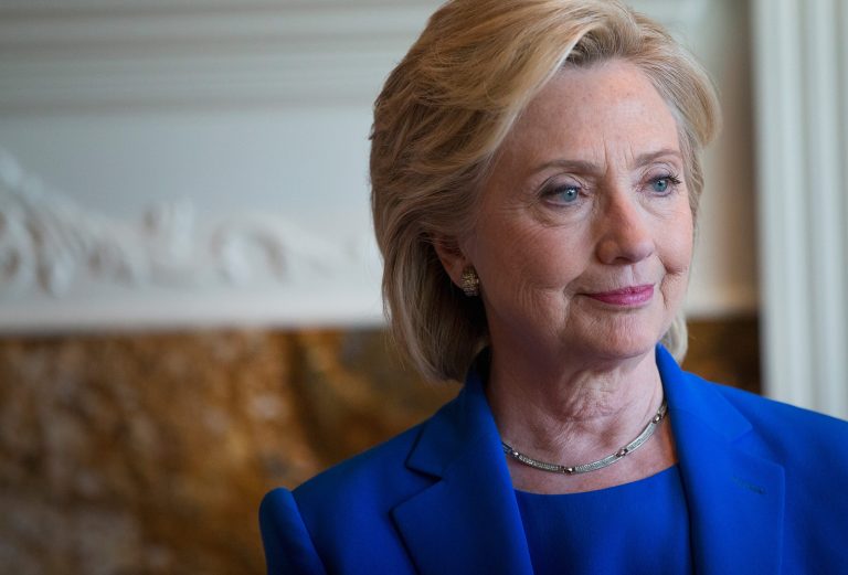 Democratic Presidential candidate Hillary Clinton chats with supporters during a campaign stop at the home of Chuck and Linda Smoley on June 13, 2015 in Sioux City, Iowa. (Photo by Scott Olson/Getty Images)