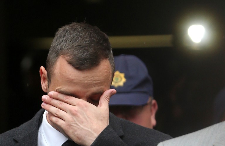 Oscar Pistorius, leaves the high court in Pretoria, South Africa, Monday, April 14, 2014. Pistorius is charged with murder for the shooting death of his girlfriend, Reeva Steenkamp, on Valentines Day in 2013. (AP Photo/Themba Hadebe)