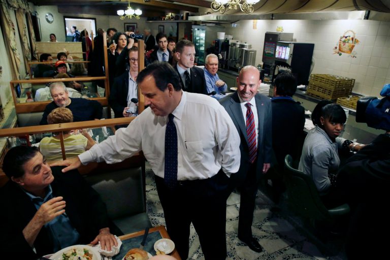 New Jersey Gov. Chris Christie, center left, and Tom MacArthur, center right, Republican candidate for New Jersey's 3rd Congressional District, greet patrons at Mastoris Diner Thursday, in Bordentown, N.J. (AP Photo/Mel Evans)