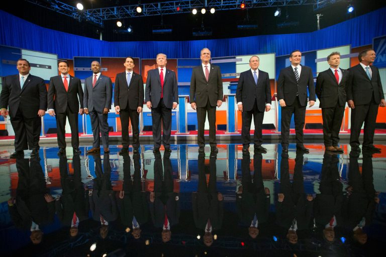 GOP presidential candidates from left, Chris Christie, Marco Rubio, Ben Carson, Scott Walker, Donald Trump, Jeb Bush, Mike Huckabee, Ted Cruz, Rand Paul, and John Kasich take the stage for the first Republican presidential debate, Aug. 6, 2015, in Cleveland. (AP Photo/Andrew Harnik)