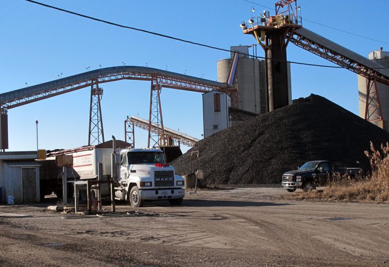 FILE - In this Dec. 26, 2013 file photo a coal truck is loaded with another payload at the Crown III underground coal mine near Farmersville, Ill. The Federal Reserve reports on the country's industrial production for December on Friday, Jan. 17, 2014. (AP Photo/Jim Suhr)