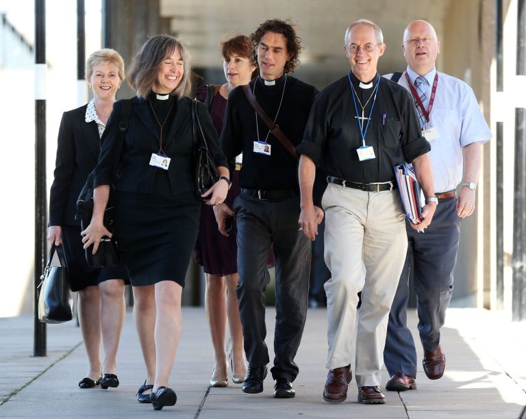 The Archbishop of Canterbury, Justin Welby, second right, and unidentified members of the clergy, arrive for the General Synod meeting, at The University of York, in York England, Monday July 14, 2014. The Church of England is set to vote on whether women should be allowed to enter its top ranks as bishops. The Church's national assembly, known as the General Synod, is meeting in York, northern England, where it will debate the issue ahead of a vote Monday. (AP Photo/PA,  Lynne Cameron) UNITED KINGDOM OUT NO SALES NO ARCHIVE