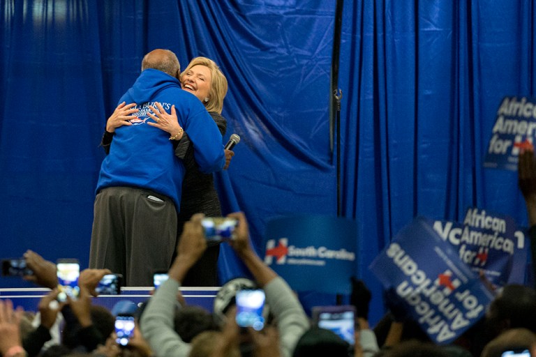 Democratic presidential candidate Hillary Clinton hugs Rep. Jim Clyburn before addressing the crowd at the Jim Clyburn Fish Fry, on Saturday, Jan. 16, 2016. (AP Photo/Stephen B. Morton)