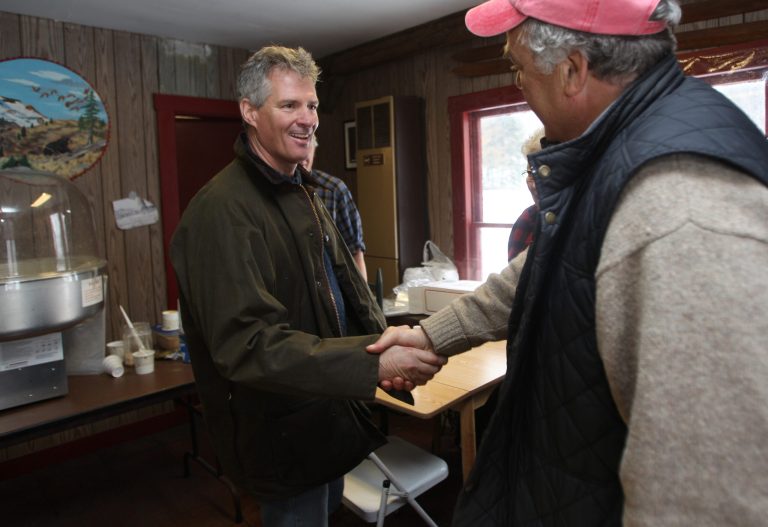 Former Massachusetts Sen. Scott Brown greeting voters at the Mount Cube maple sugar house in Orford, N.H. (AP/Jim Cole)
