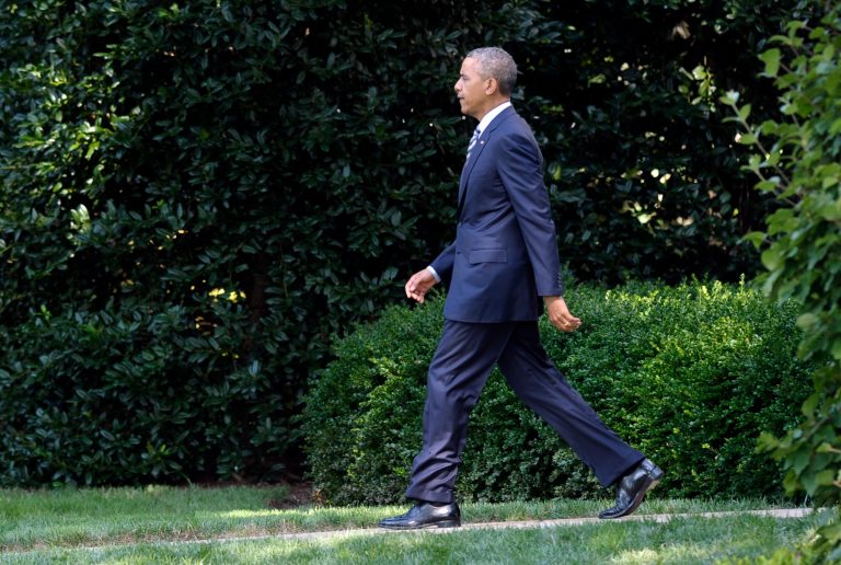 President Barack Obama walks from the Oval Office to Marine One on the South Lawn of the White House in Washington, Friday, July 26, 2013. Obama is spending the day at Camp David with members of his cabinet and their families. (AP Photo/Susan Walsh)