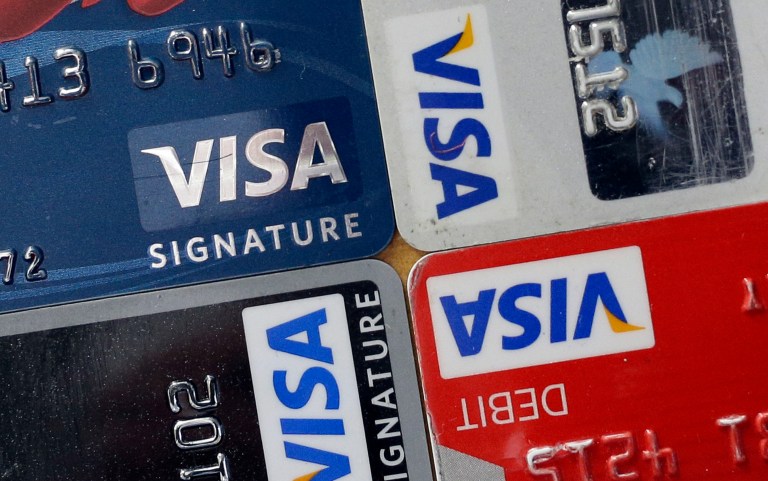 Visa and MasterCard had been price-fixing the fees that banks charge merchants to process the transaction when a customer swipes a debit card to pay for everything from lunch to laundry soap. (AP Photo/Patrick Semansky, File)
