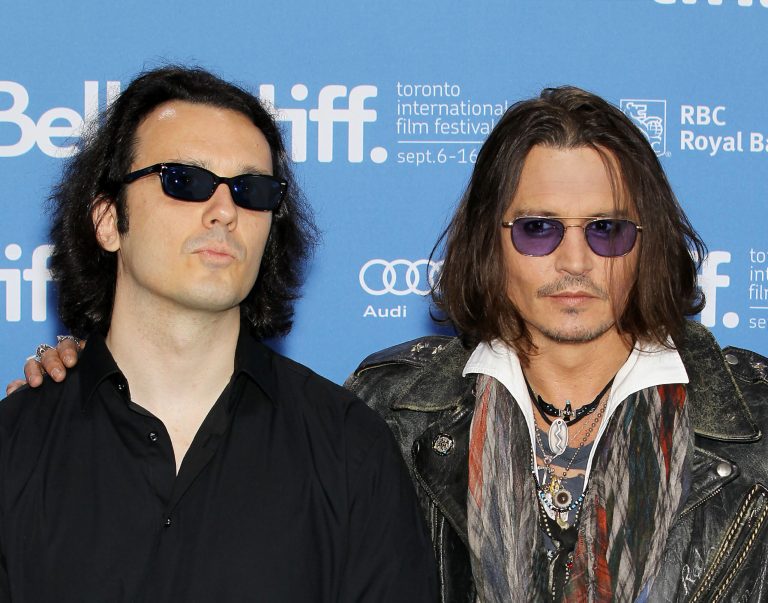 This image released by Starpix shows Damien Echols, one of the West Memphis Three, left, and actor Johnny Depp at a press conference for the film 