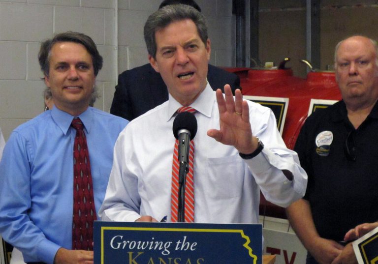 Kansas Gov. Sam Brownback is trailing his Democratic challenger, Paul Davis, by 10 points in a Rasmussen poll. (AP Photo/John Hanna)