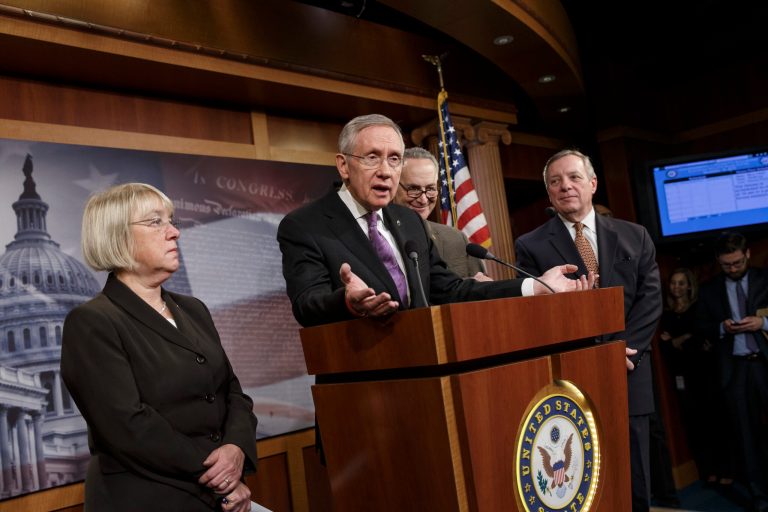 Senate Majority Leader Harry Reid, center, promises a vote no later than Jan. 7 on a measure to extend jobless benefits for three months. He said the number of jobless people out of work for more than six months is far greater than in past economic recoveries. (AP Photo/J. Scott Applewhite)