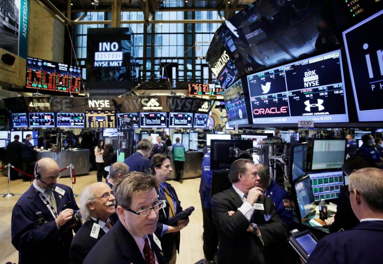 FILE - In this  Wednesday, Feb. 12, 2014, file photo, traders monitor stock prices at the New York Stock Exchange. Stocks were mostly higher in midday trading Tuesday, Feb. 18, 2014, as investors returned from a long holiday weekend.  (AP Photo/Mark Lennihan)