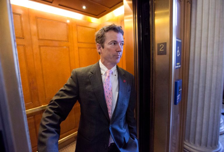 FILE - In this March 7, 2013, file photo, Sen. Rand Paul, R-Ky. is questioned by reporters in an elevator as he leaves a GOP policy meeting on Capitol Hill in Washington. Paul says he's only 