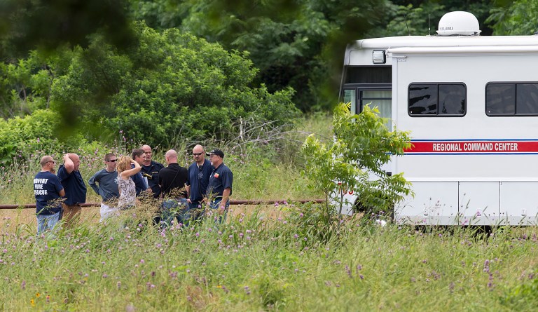 Emergency responders talk near the scene of an accident at Fort Hood at Owl Creek Park near Gatesville, Texas. (Michael Miller/The Temple Daily Telegram via AP) MANDATORY CREDIT